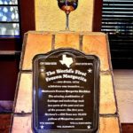 plaque stating dallas is home to the first frozen margarita machine