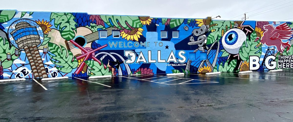 DALLAS mural on building in parking lot