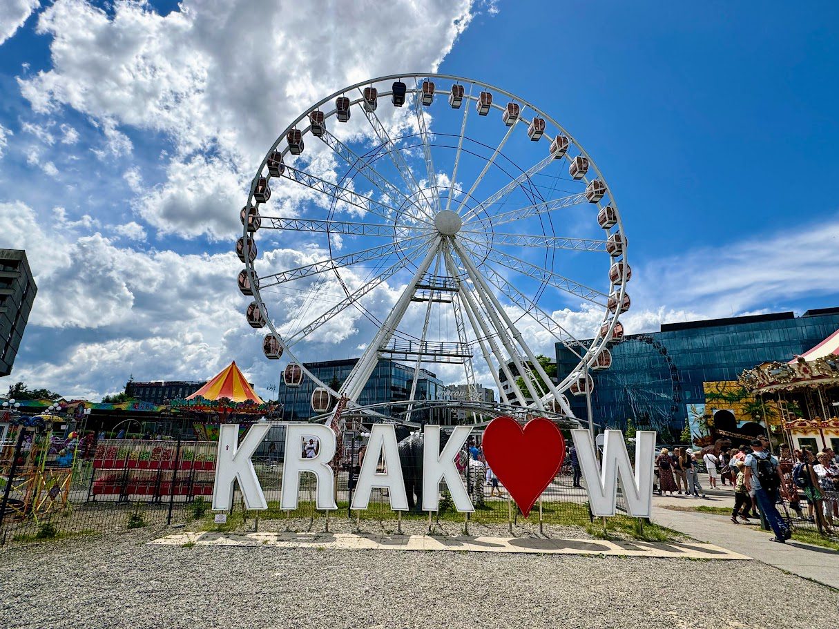 krakow poland letter sign with heart in front of ferris wheel