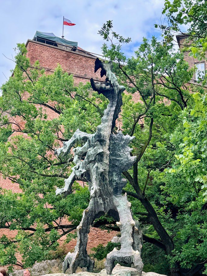 fire breathing dragon statue krakow poland smok wawelski