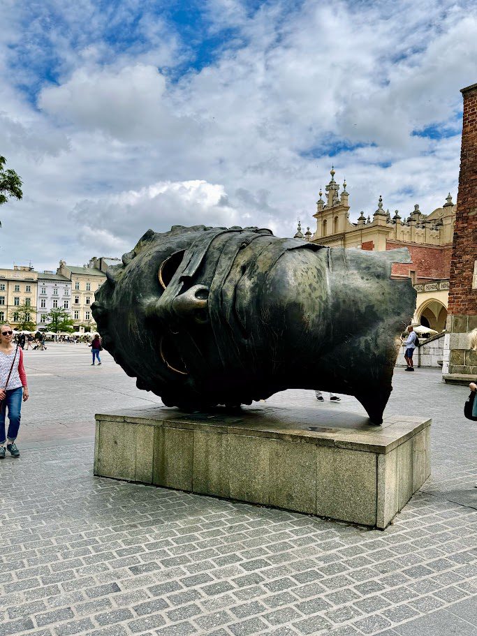 krakow poland statue of head in square